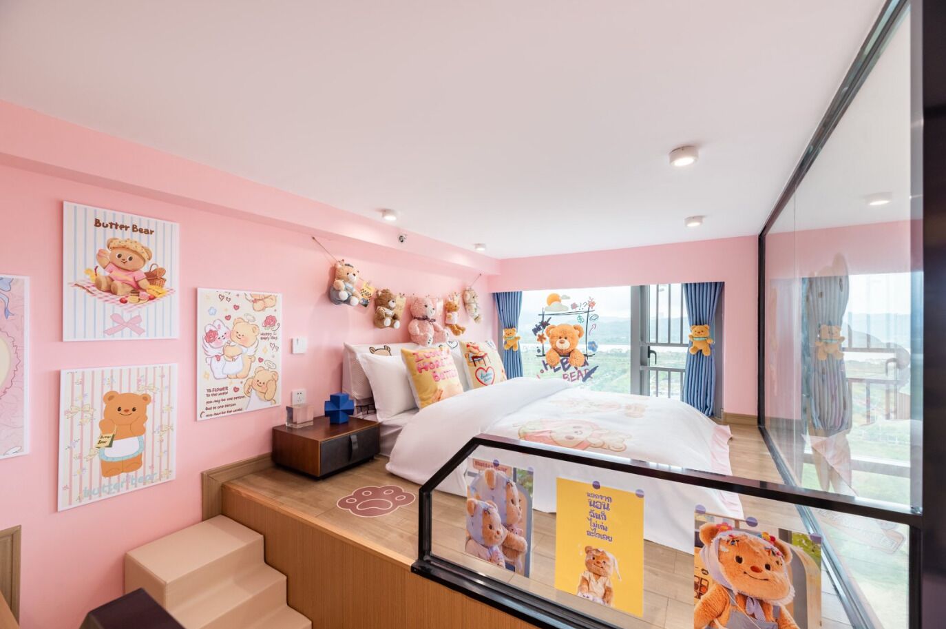 A pink-themed bedroom with a bed, a desk, and a window with a view.