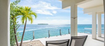 Open-water home with stunning views, 42' seawall for 40' boat, modern updates, large balcony