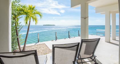 Open-water home with stunning views, 42' seawall for 40' boat, modern updates, large balcony