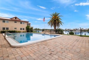 Outdoor pool, a heated pool - Scenic Waterfront 2 BR/2 BA Cape Coral Condo (Cape Coral)