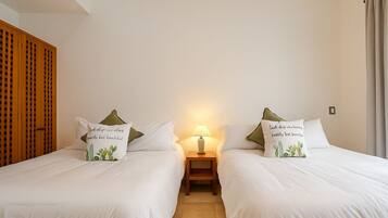 Down duvets, desk, laptop workspace, blackout curtains