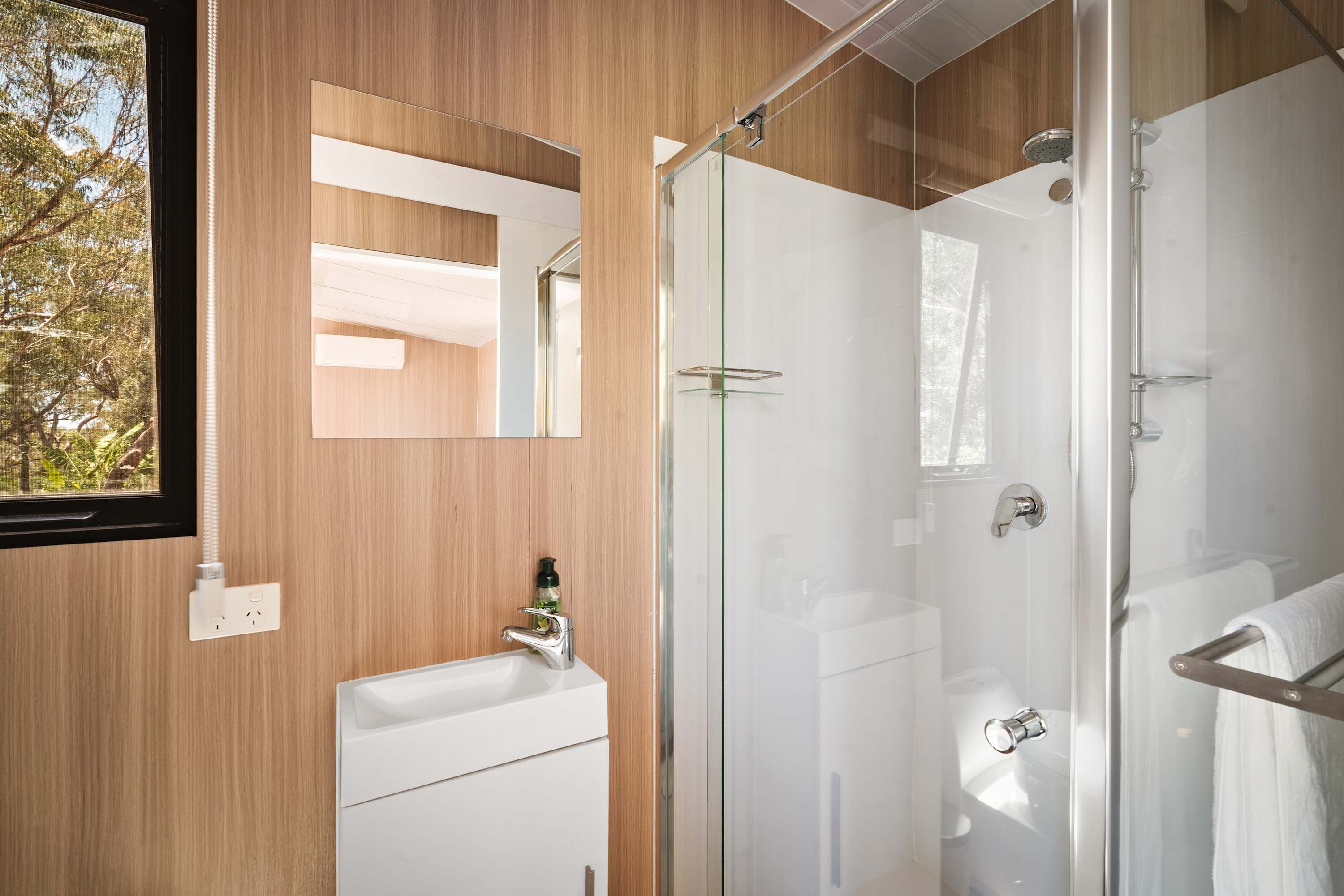 Shower, hair dryer, towels, shampoo