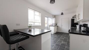 Coffee/tea maker, fridge, microwave, oven