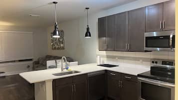 Coffee/tea maker, fridge, microwave, oven
