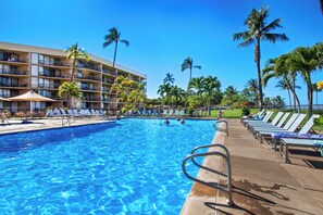 Outdoor pool, open 9:00 AM to 9:00 PM, pool umbrellas, sun loungers - 2BR/2BA Oceanfront Condo in Maui Sunset (Kihei)