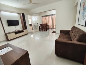 1 BHK Super Luxury | Living area | 40-inch LED TV with digital channels - Crown regency (Mangaluru)