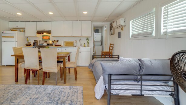 A compact living space with a kitchenette, dining area, and a bed with a headboard fan. - 5 Mi to Dtwn Riverside & Hospital! Remote-Work Hub (Riverside)