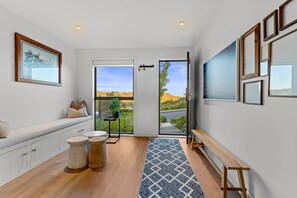 TV, fireplace, books - Spacious Coastal Luxe Home with Sea View & Parking (Auckland Hibiscus Coast)