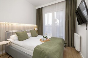 1 habitación, tabla de planchar con plancha, cuna de viaje y wifi 