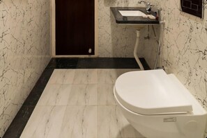 Standard Double Room, City View | Bathroom | Shower, free toiletries, hair dryer, slippers