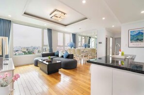 Family Suite, 3 Bedrooms, Club Lounge Access, City View | Living area | 65-inch Smart TV with cable channels, fireplace, Netflix - Sarang Smile Luxstay Leman Residence (Xuan Hoa)