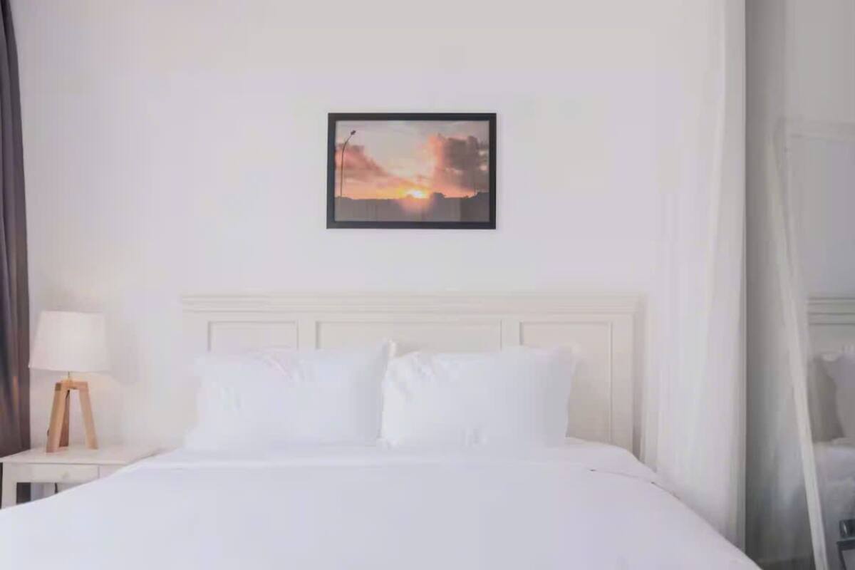 Premium bedding, down duvets, Select Comfort beds, free minibar