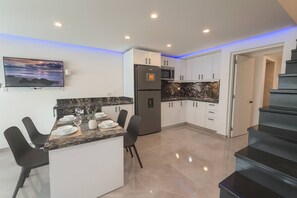 Fridge, microwave, stovetop, coffee/tea maker