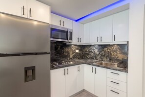 Fridge, microwave, stovetop, coffee/tea maker