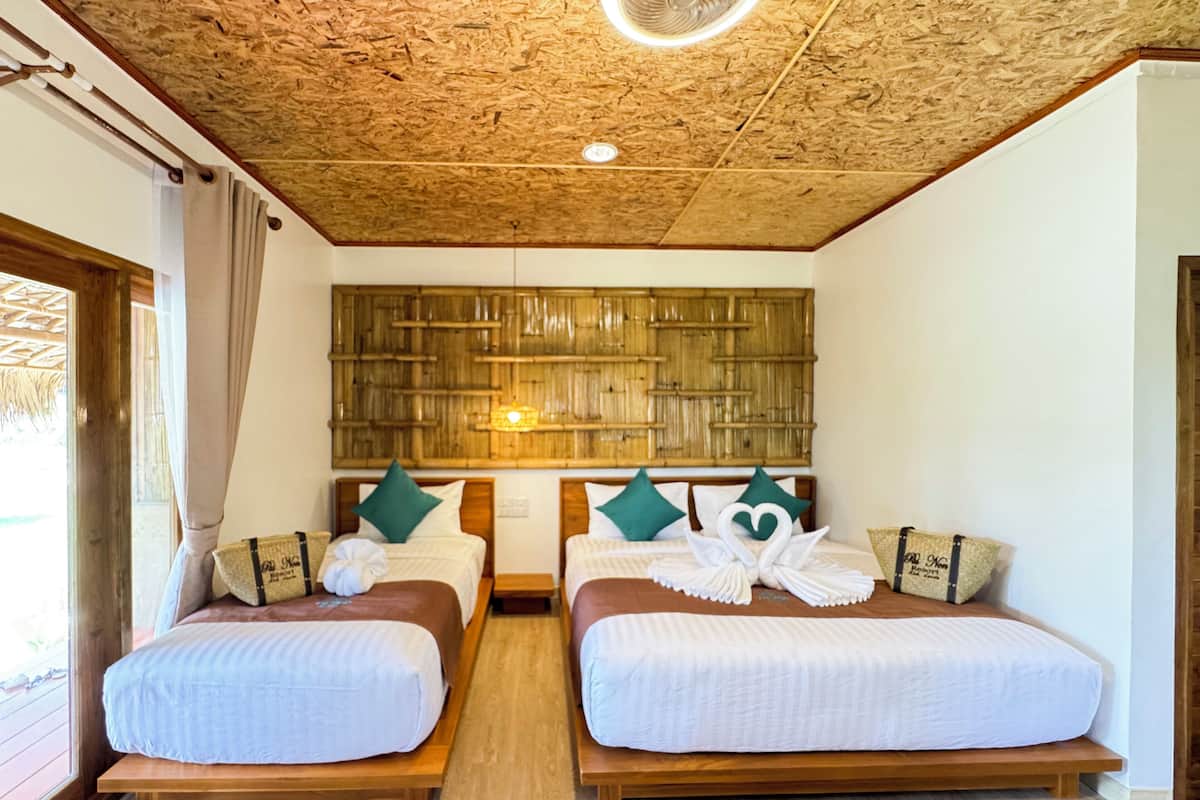 Deluxe Triple Room, Garden View | In-room safe, laptop workspace, blackout curtains, free WiFi