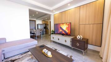 Classic Apartment, Balcony, City View | Living area | 55-inch Smart TV with cable channels, Netflix, first-run movies