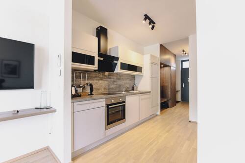 Departamento Deluxe, balcón, vista a la ciudad | Cocina privada | Tetera eléctrica