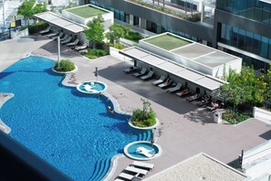 Outdoor pool - Chic 1BR Apartment -  Pool View - The Crest Dubai (Zaa'beel Second)