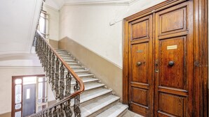 A staircase with ornate metal railings leading to a wooden door labeled "RESTAURANT." - Relax in Centro (Naples)