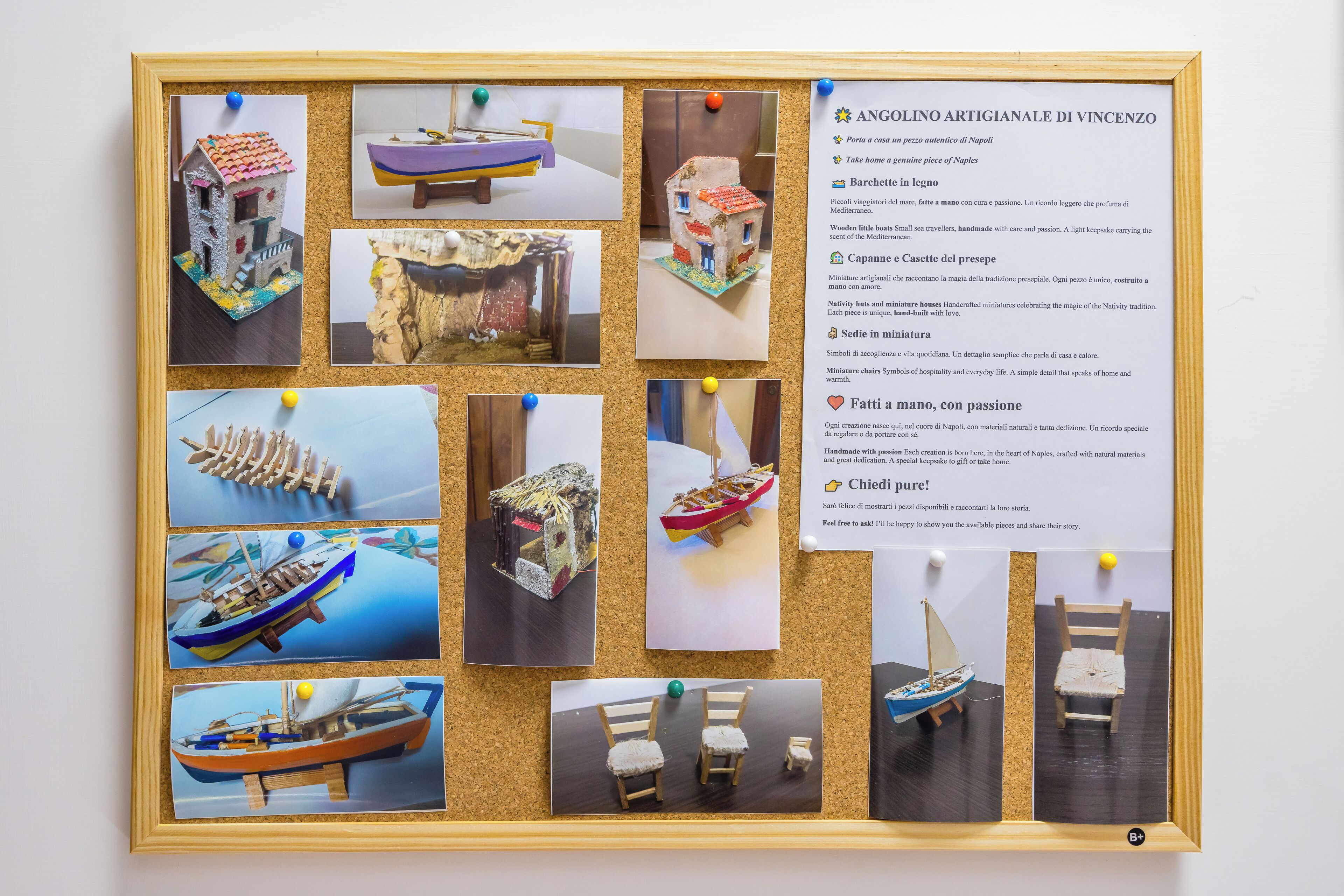 A corkboard with various handcrafted miniature models, including boats and a chair, each accompanied by a descriptive text.