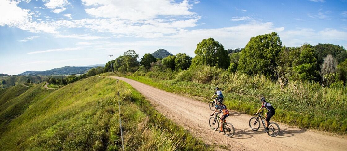 A dirt road with cyclists.