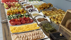 A buffet with various food items including fruits, vegetables, cheeses, meats, and pastries. - BnB Hotel Shymkent (Shymkent)