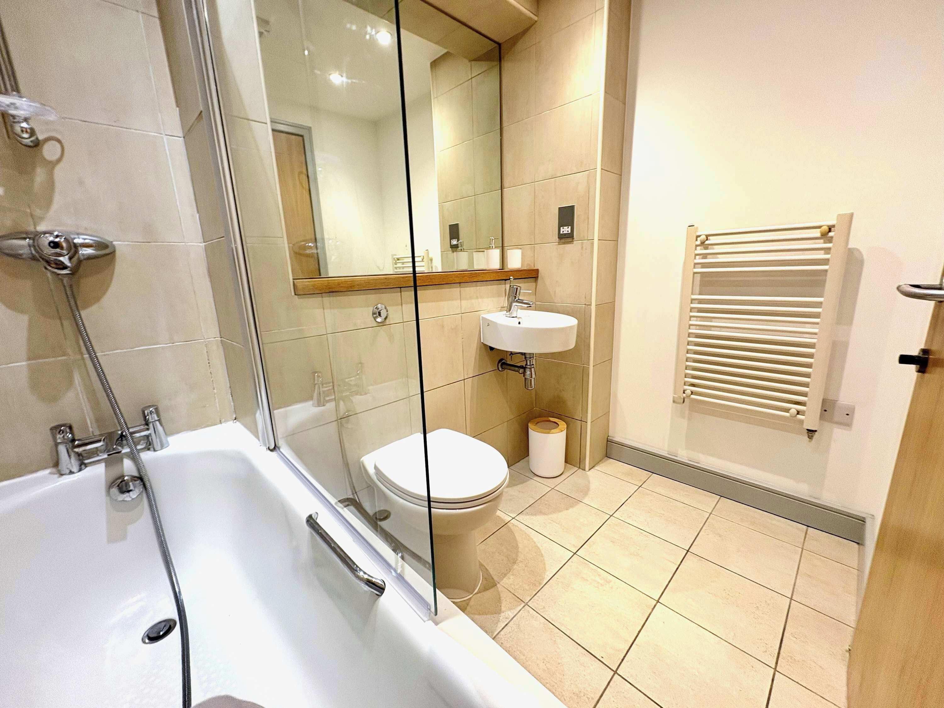 Shower, hair dryer, towels, shampoo