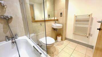 Shower, hair dryer, towels, shampoo