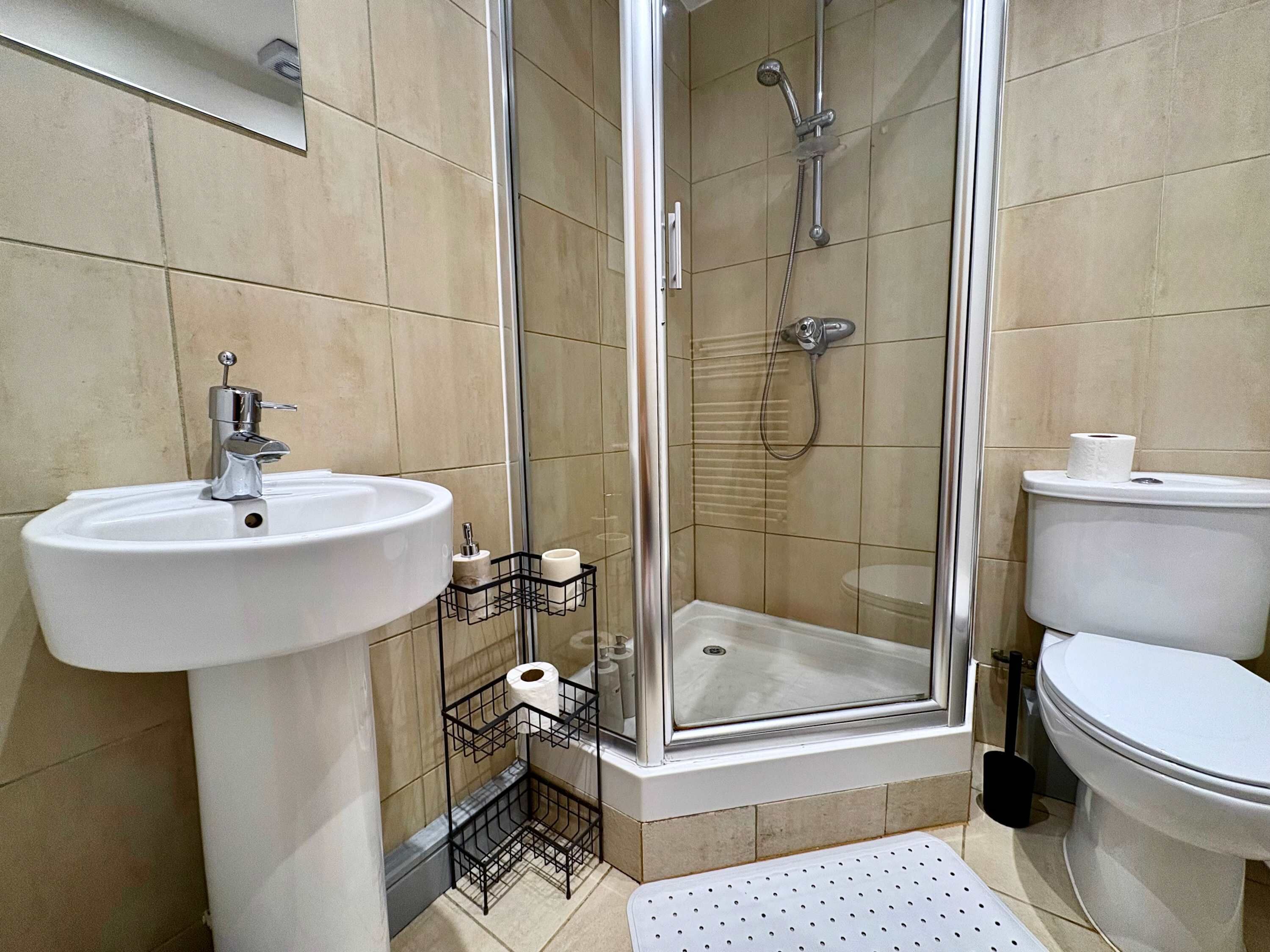 Shower, hair dryer, towels, shampoo