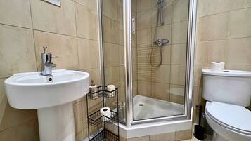 Shower, hair dryer, towels, shampoo