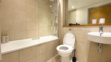 Shower, hair dryer, towels, shampoo