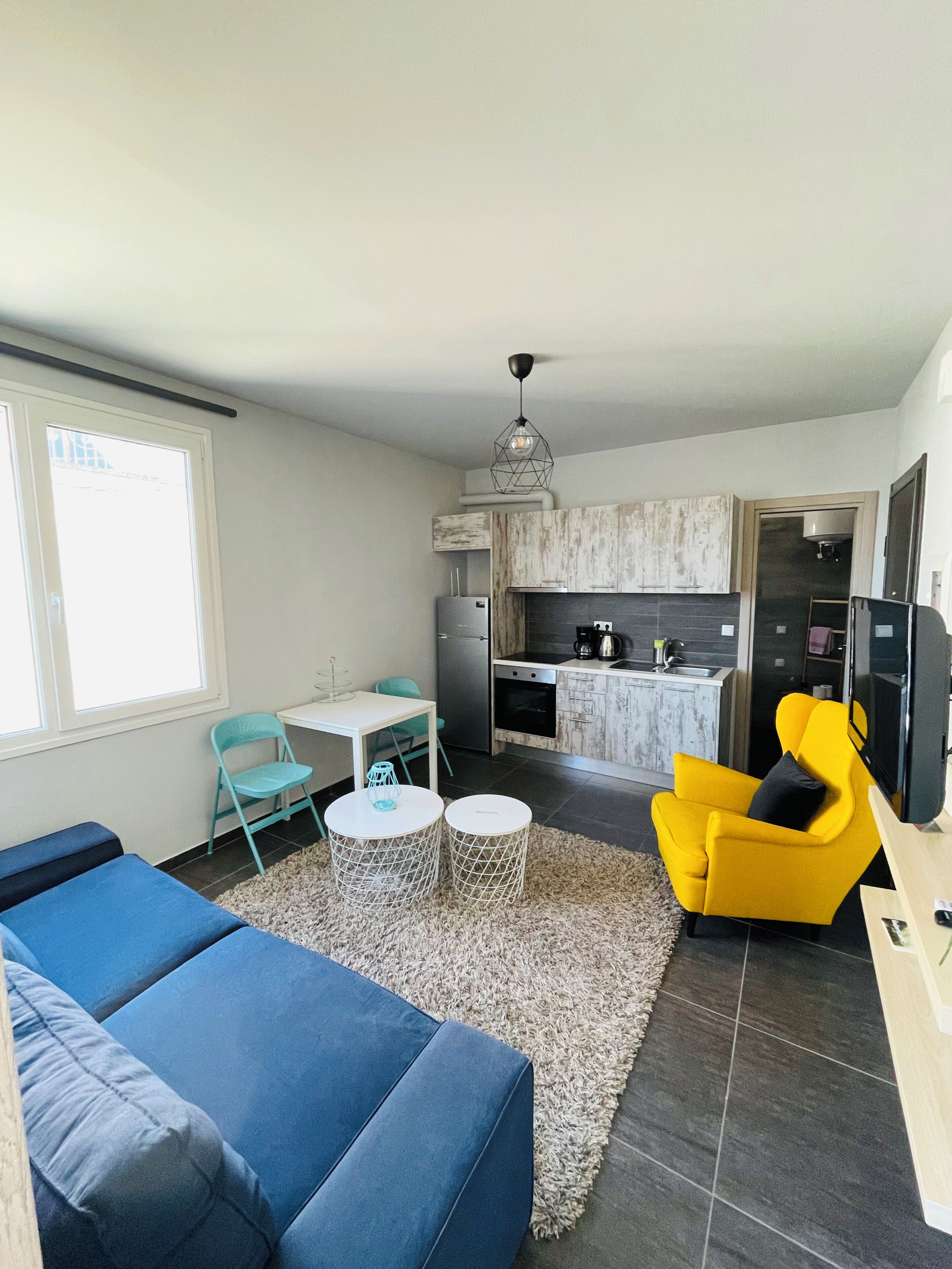 Apartamento superior, vista para a cidade | Área de estar