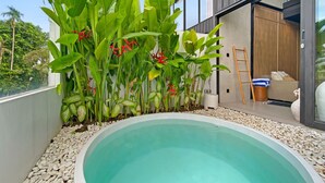 A modern house with a swimming pool surrounded by tropical plants. - Brand New Private Pool Villa (canggu)