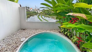 A small, private pool with a view of terraced fields and a building in the background. - Brand New Private Pool Villa (canggu)
