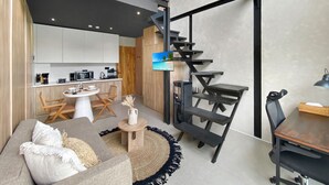 A modern interior with a staircase, a dining area, and a living room. - Brand New Private Pool Villa (canggu)