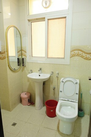 Shower, towels, soap, toilet paper