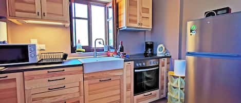 Microwave, coffee/tea maker, high chair, cookware/dishes/utensils