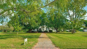 A pathway leading to a house surrounded by trees. - Walk to Dtwn Warsaw: Family Home w/ Deck! (Warsaw)