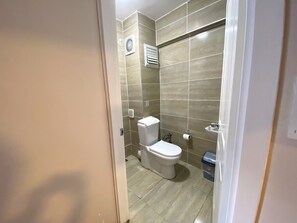 Classic Triple Room, Pets Not Allowed, City View | Bathroom | Shower, hair dryer, slippers, towels