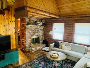 Smart TV, fireplace, table football, books
