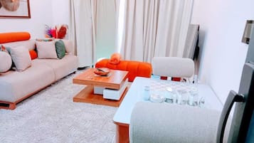 Classic Apartment, Balcony, City View | Living area | 55-inch Smart TV with cable channels, Netflix, first-run movies