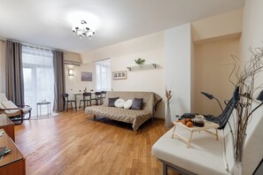 Comfort Apartment, Balcony, Courtyard View | Living area | 35-inch TV with cable channels - Spacious apartments near Pobedy Square (Minsk)