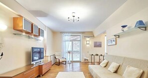 Comfort Apartment, Balcony, Courtyard View | Living area | 35-inch TV with cable channels - Spacious apartments near Pobedy Square (Minsk)