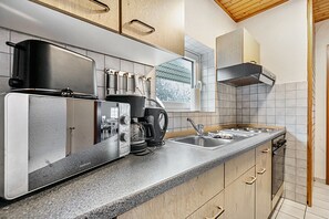 Coffee/tea maker, fridge, microwave, oven