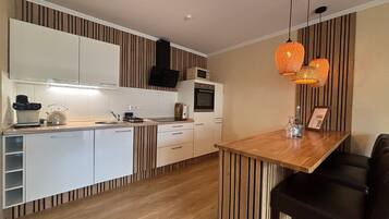 Fridge, microwave, stovetop, coffee/tea maker