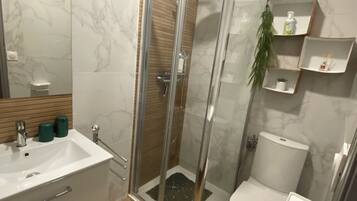 Shower, hair dryer, towels, soap