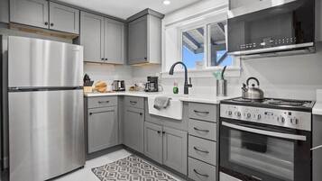 Fridge, microwave, toaster, cookware/dishes/utensils