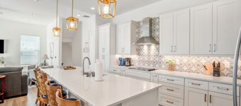 Brand new custom home STEPS from the beach and times square - Unbelievable ocean views, stunning pool and spa and large entertaining space!