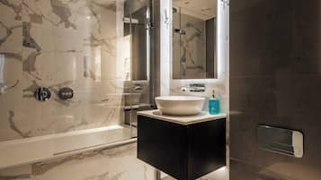 Shower, hair dryer, towels, shampoo