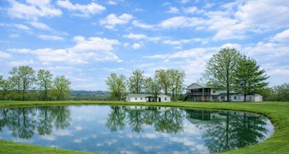 Relax at this peaceful two home countryside retreat with a private hot tub, pond views, 2 fire pits, and fishing for cozy comfort and country charm for everyone.